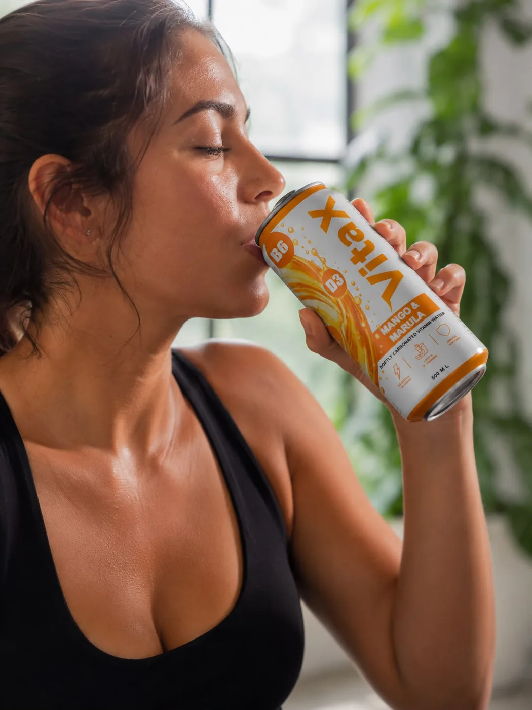 Taking a sip of VITA X Mango & Marula